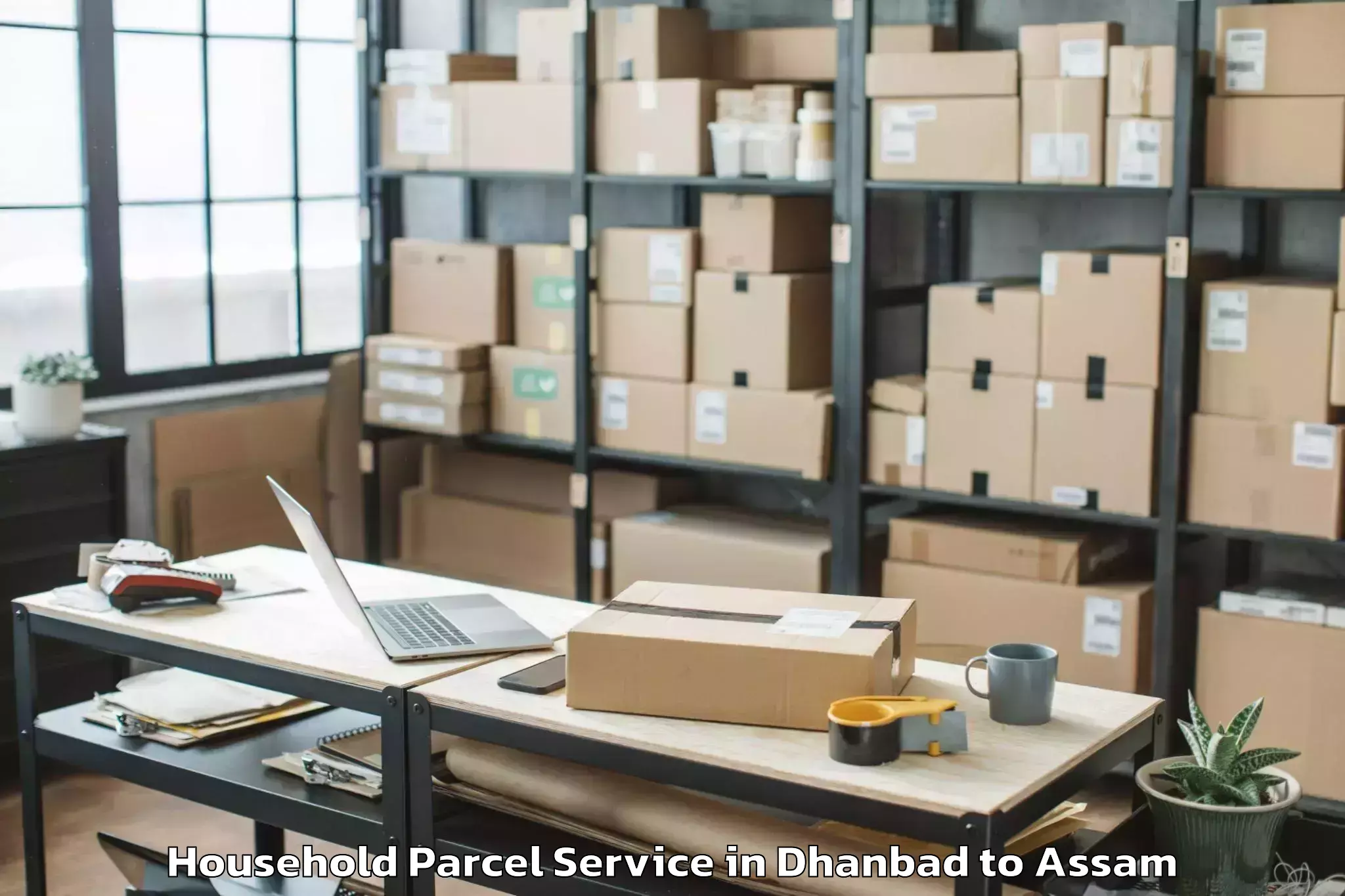 Book Dhanbad to Sualkuchi Household Parcel